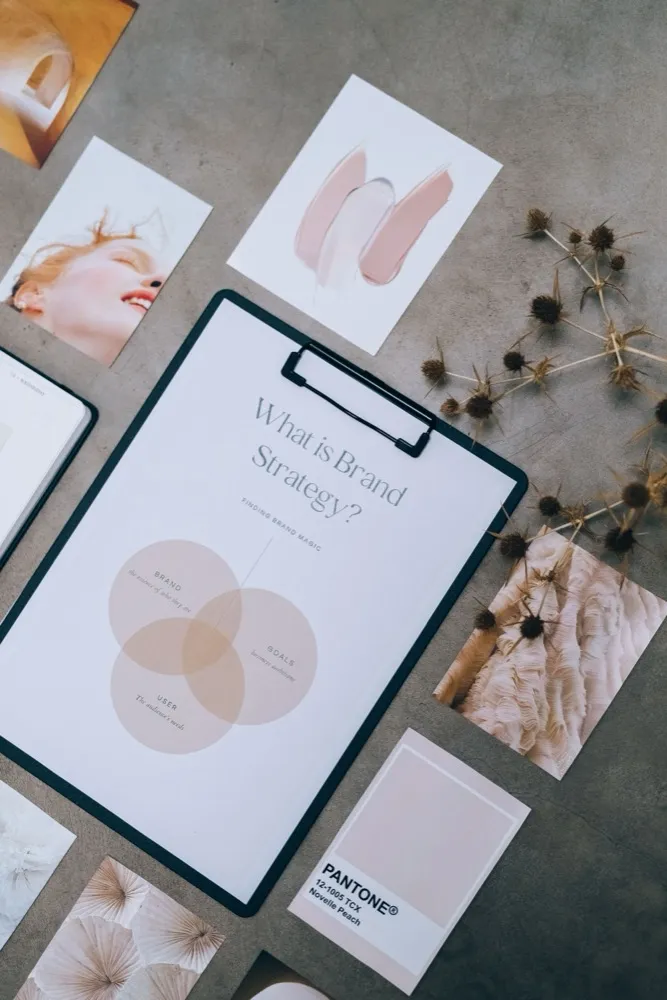 Flat lay of brand strategy documents, swatches and moodboard clippings